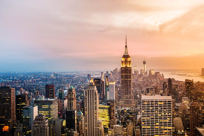 New York City skyline with urban skyscrapers at sunset.