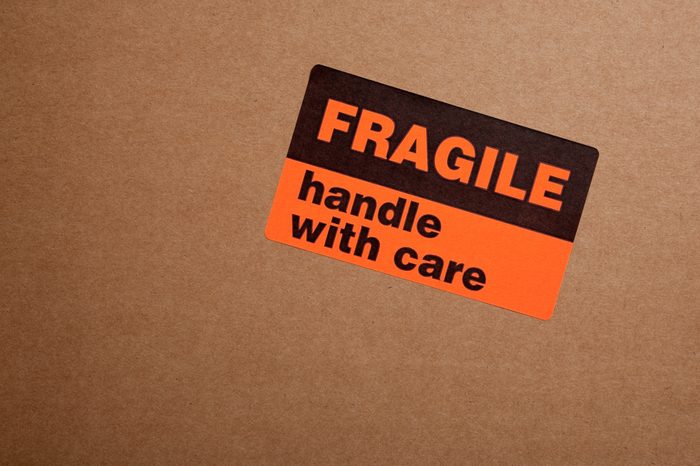 Moving boxes with fragile sticker on a white background