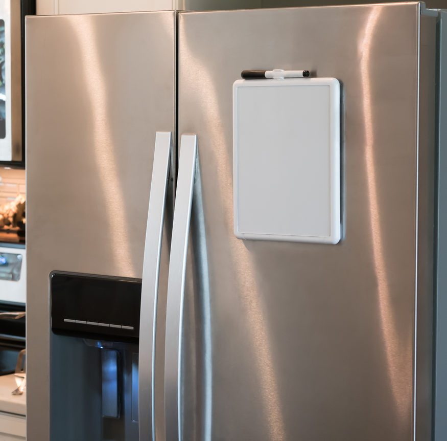Stainless steel refrigerator with a magnetic dry erase whiteboard