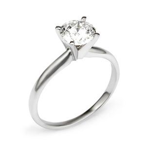A silver ring displays a large, round diamond atop its band, set against a plain white background.