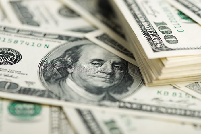 Stack of one hundred dollar bills close-up. (shallow DOF)