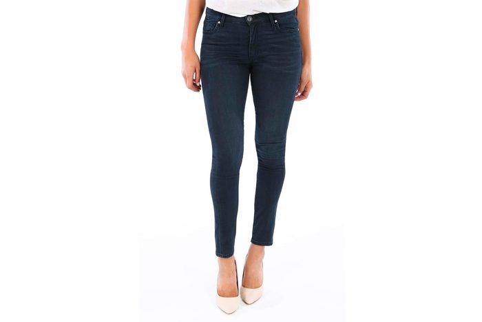 Jeans on purple background with cancel sign over it