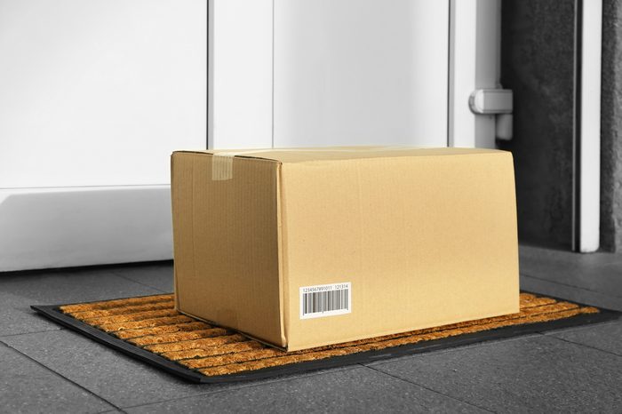 Parcel in cardboard box left on door step (it's not real QR code)