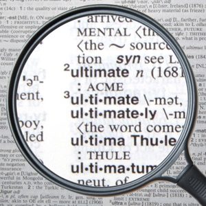 A magnifying glass enlarges the word 