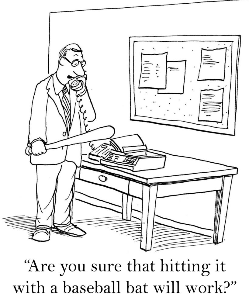 Man holds baseball bat, talks on phone in office, questioning its use on malfunctioning machine. Wall displays notices; text reads, "Are you sure that hitting it with a baseball bat will work?"