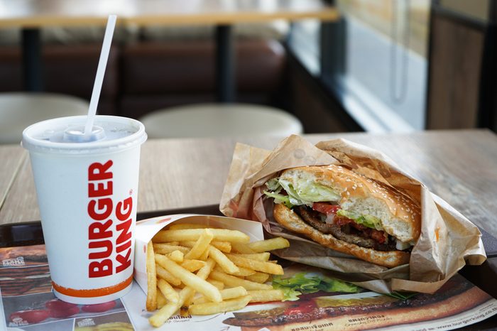 Nakhon Pathom, Thailand - May 10, 2018 : Burger King Cola Cup, Potato french fries and Whopper Hamburger in Burger King restaurant. Burger King is a global chain of hamburger fast food restaurants