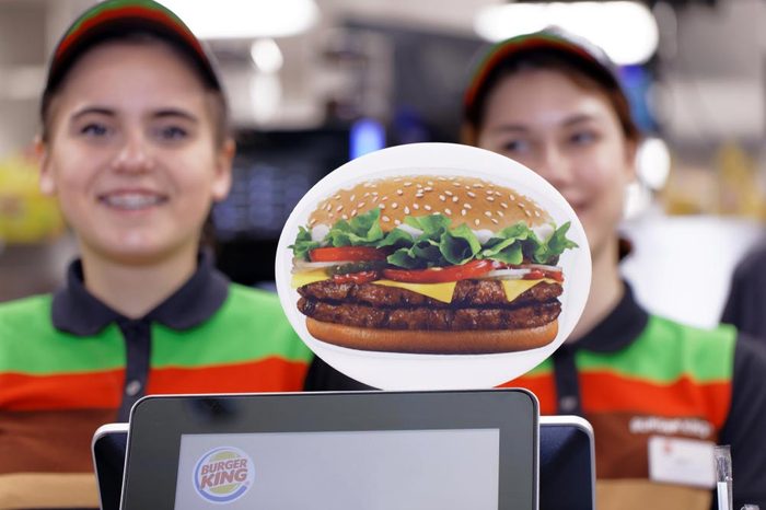 ST. PETERSBURG, RUSSIA - NOVEMBER 29, 2017: Staff of 500th Burger King restaurant in Russia in the service area in the day of opening. First Burger King restaurant opened Russia in 2010