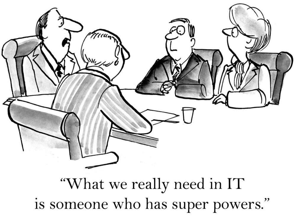 Four people sit around a conference table discussing IT needs humorously. Text: "What we really need in IT is someone who has super powers.â€