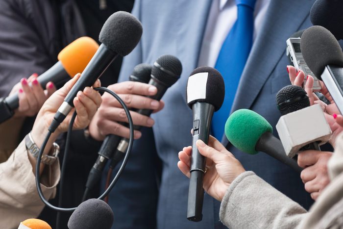 Media interview - group of journalists surrounding VIP