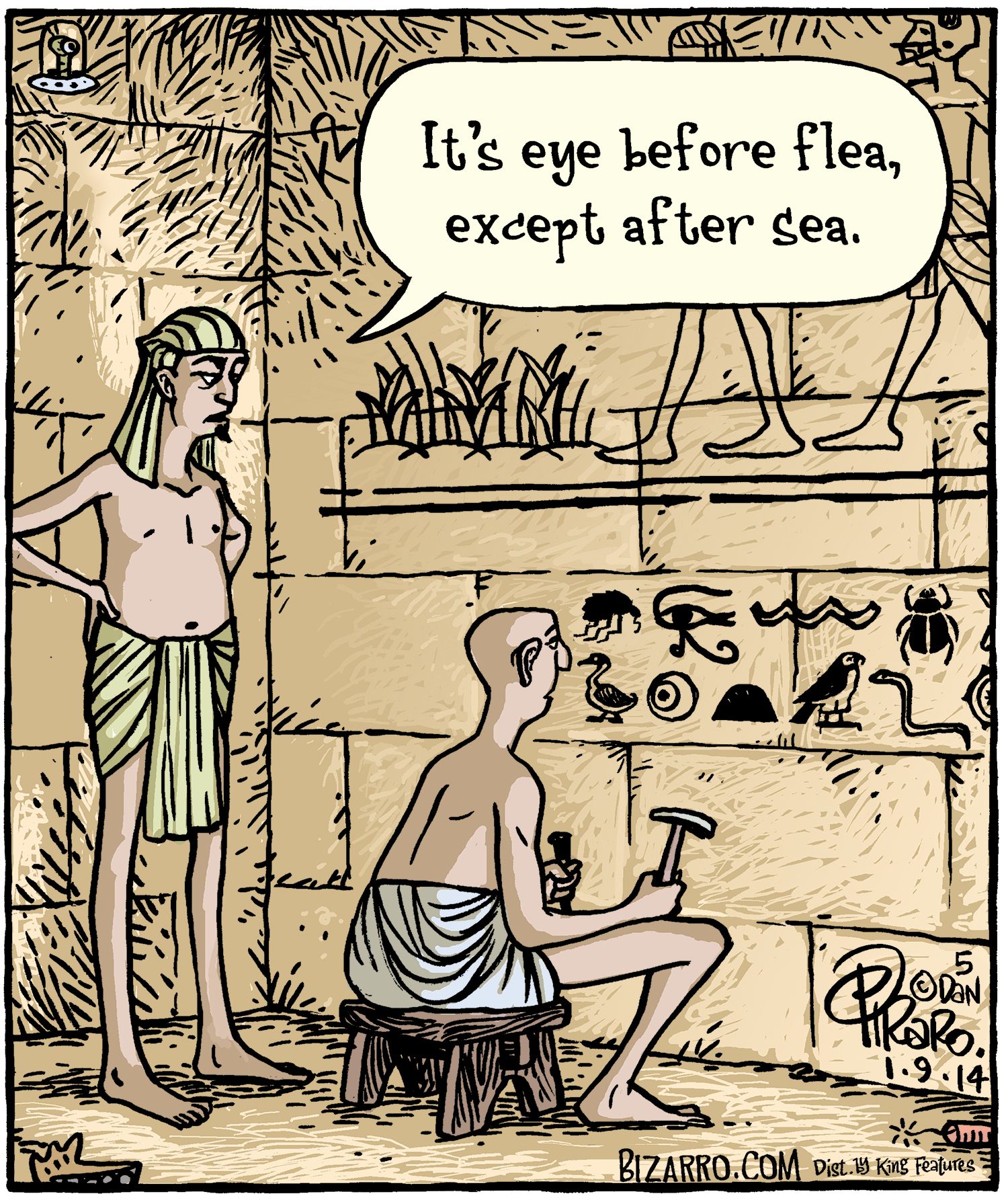 Scribe chisels hieroglyphics on a stone wall while standing Egyptian observes. Speech bubble says, "It's eye before flea, except after sea."