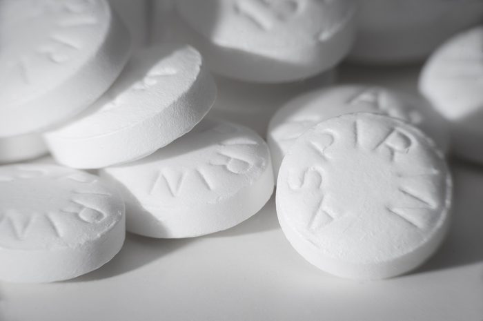 Macro shot of white asiprin on white background.