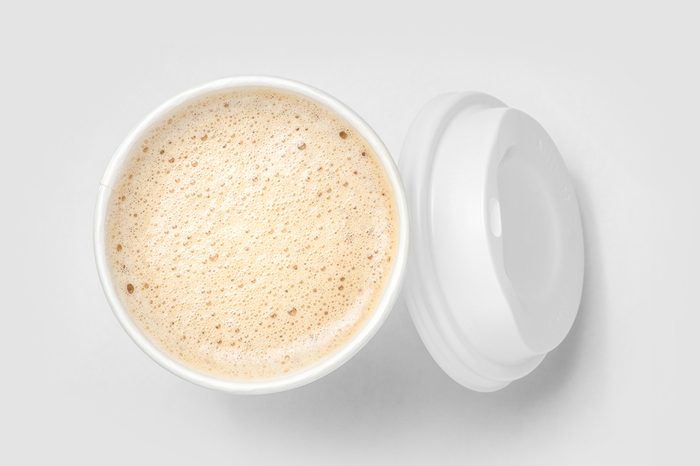 top view of paper cup mix latte coffee foam, white background