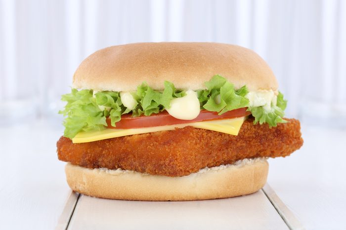 Fish burger fishburger hamburger fresh tomatoes lettuce cheese onion
