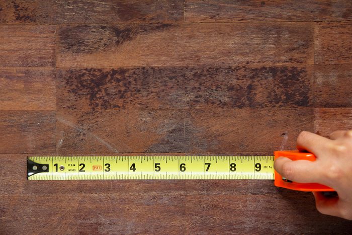 Hand with instrument of measure