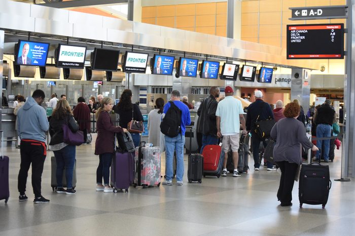 Raleigh, NC/United States- 11/12/2018: Passengers wait to check bags in a long line at RDU International airport.
