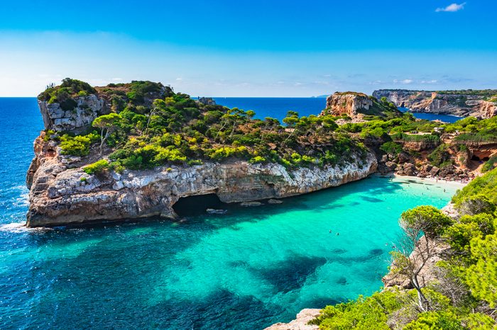 Beautiful beach bay with tropical turquoise water, Cala des Moro, Majorca island, Spain Mediterranean Sea.