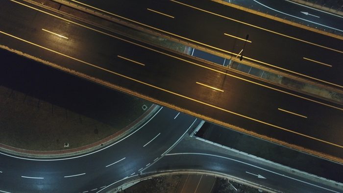 aerial view of highway empty road city street in night