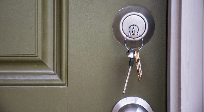 Home Ownership the day you get your new Keys to your new home. House keys inside door lock