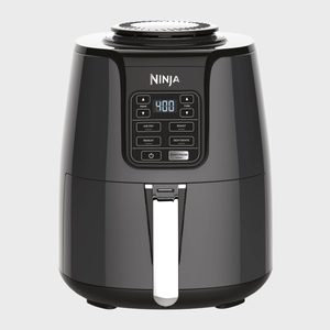 Air fryer displays buttons and digital screen, showing 400 degrees. Options include air fry, roast, reheat, and dehydrate. Sleek design in a neutral setting.