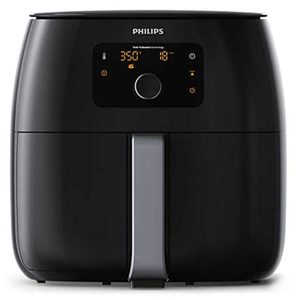 An air fryer with a digital display shows temperature and time settings. 