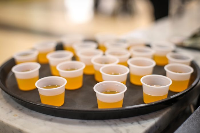 Samples of a jellylike substance are handed out to passerbys at a shopping center.