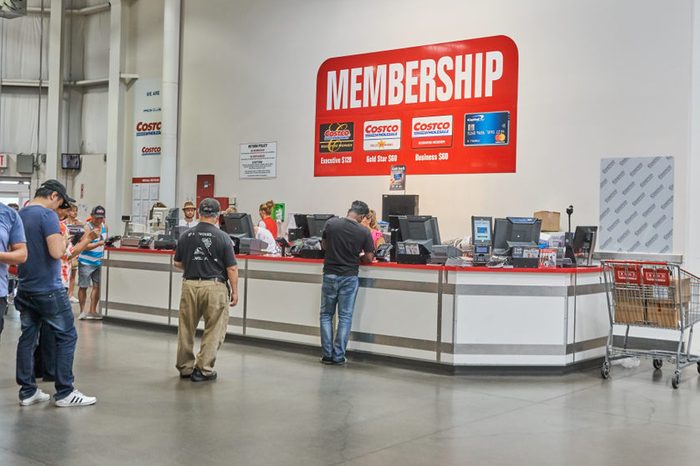 TORONTO, CANADA - AUGUST 15, 2018: Line of a people at customer service desk in a Costco store. Costco, is an American corporation which operates a chain of membership-only warehouse clubs.