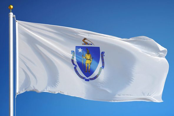 Massachusetts (U.S. state) flag waving against clear blue sky, close up, isolated with clipping path mask alpha channel transparency, perfect for film, news, composition
