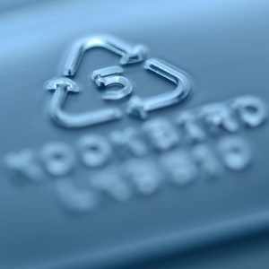Recycling symbol embossed, showing 