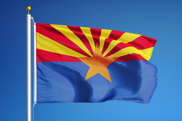 Arizona (U.S. state) flag waving against clear blue sky, close up, isolated with clipping path mask alpha channel transparency, perfect for film, news, composition