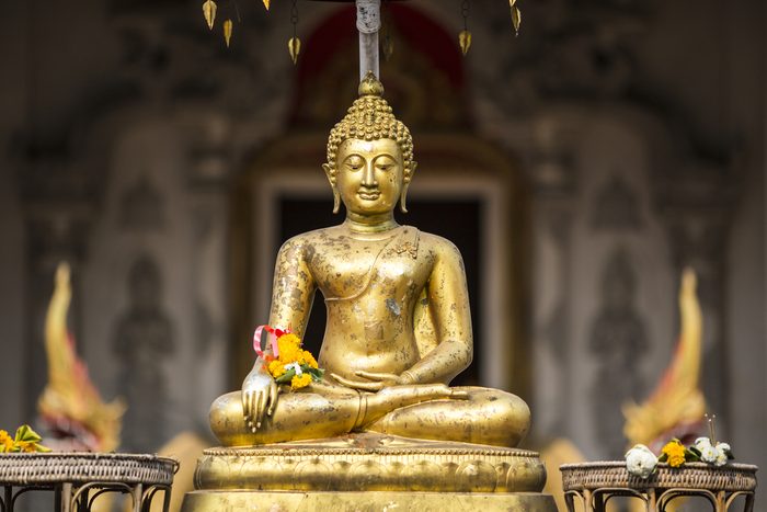 Golden buddha on front of Chiang Mai temple Sonkran festival. Thailand.