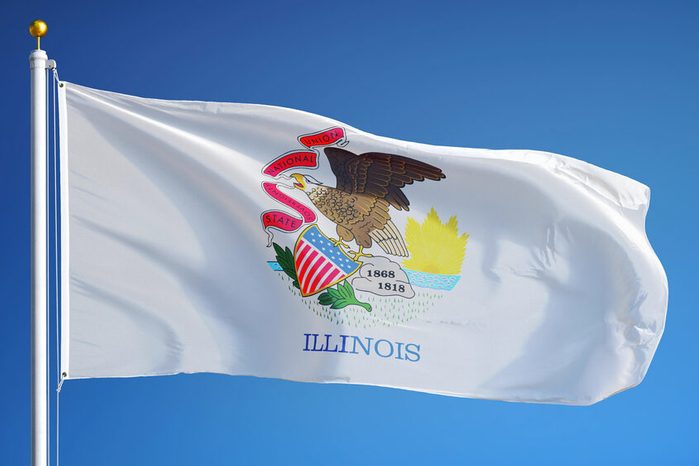 Illinois (U.S. state) flag waving against clear blue sky, close up, isolated with clipping path mask alpha channel transparency, perfect for film, news, composition