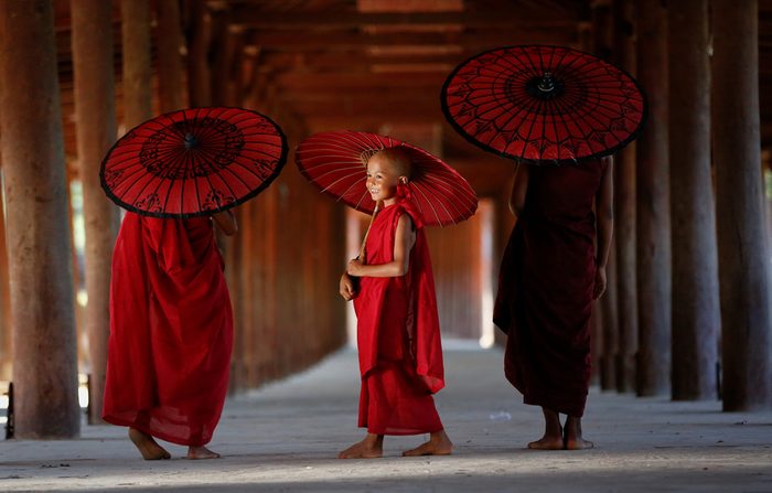 MONK MYANMAR, Southeast Asian young three little monk walkink morning alms in bagan, Buddhist in pagoda myanmar background,