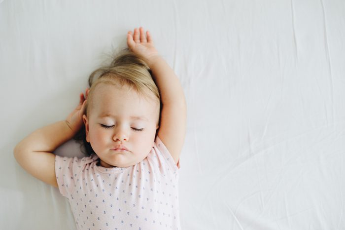 One year old baby girl sleeping.