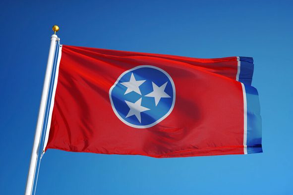 Tennessee (U.S. state) flag waving against clear blue sky, close up, isolated with clipping path mask alpha channel transparency, perfect for film, news, composition