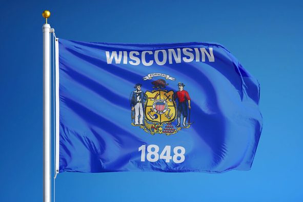 Wisconsin (U.S. state) flag waving against clear blue sky, close up, isolated with clipping path mask alpha channel transparency, perfect for film, news, composition