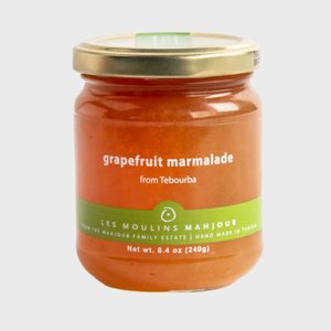 Jar holds grapefruit marmalade; sits on a plain background. Text reads â€œgrapefruit marmalade from Tebourbaâ€ and â€œLES MOULINS MAHJOUB.â€ Capacity is 8.4 oz.