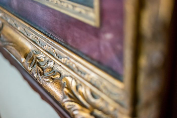 Old gilded frame. Antique frame with ornament. Recognize the art.