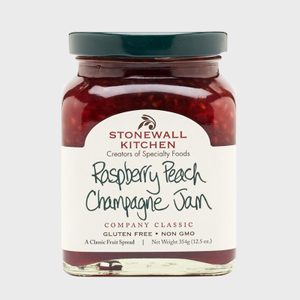 Jar contains raspberry peach champagne jam, labeled with 