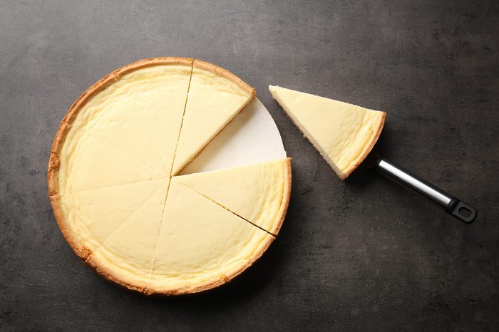 Tasty homemade cheesecake on grey table