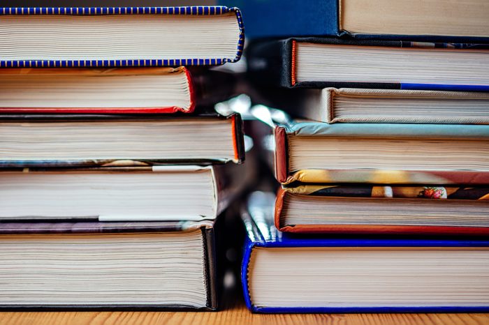 Many books piled on a stack