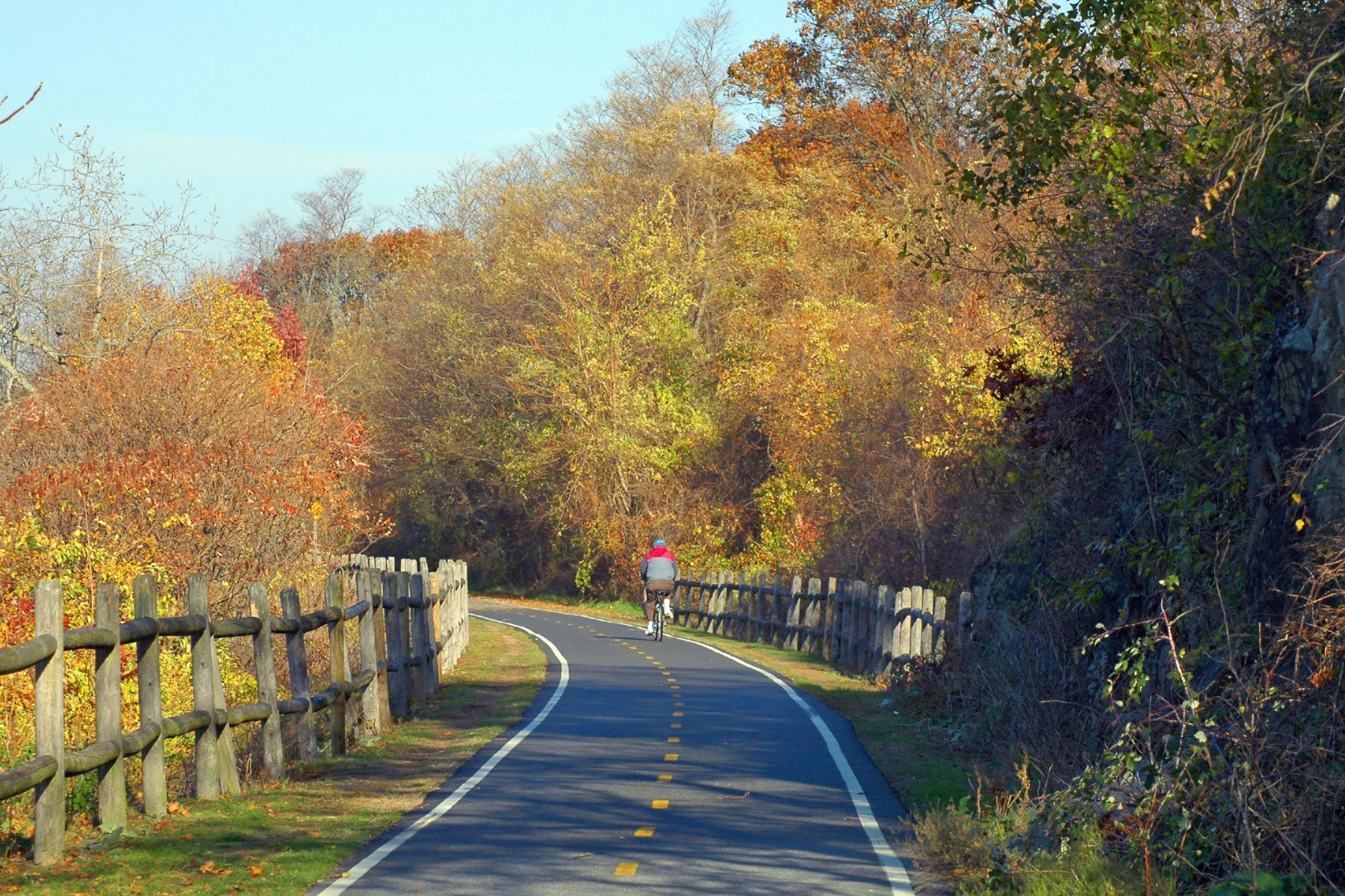 Cyclist on the East Bay Bike Path in Bristol, RI