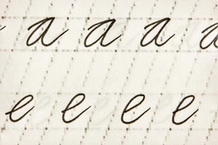 Calligraphy on a white sheet of paper, background