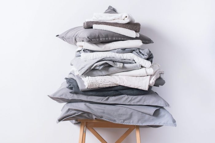 stacks monochrome gradient white gray black bed linen textiles clothing background pile concept