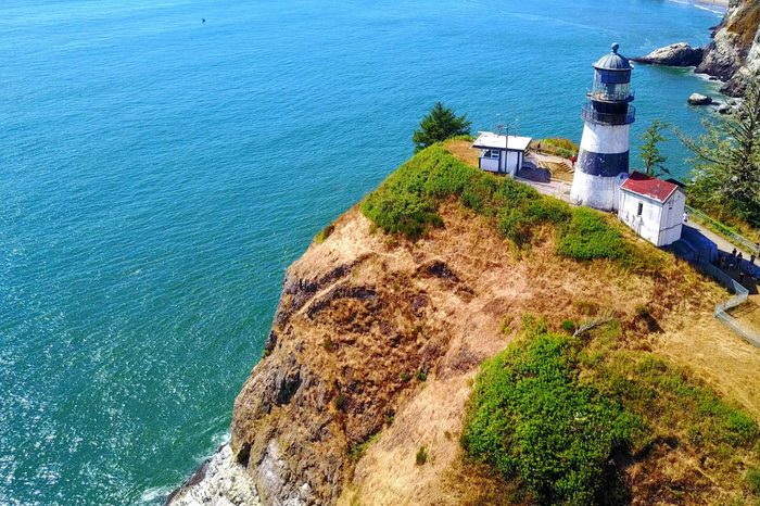 Aerial View Of Lighthouse On Cape Disappointment On Rocky Point - Washington, USA - 4K Aerial Footage