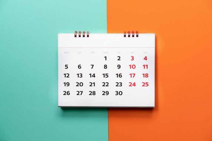 close up of calendar on the color table, planning for business meeting or travel planning concept