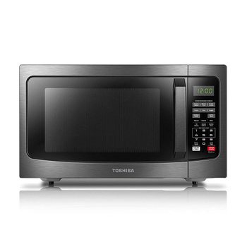 Microwave displaying "12:00," with control panel featuring numeric keypad and function buttons, situated in a modern, stainless steel kitchen appliance setting.