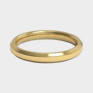 A gold ring rests on a plain white background, showcasing a smooth, polished surface with a slightly beveled edge.