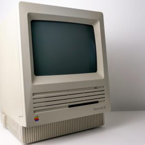 Retro computer sits on a desk; labeled 