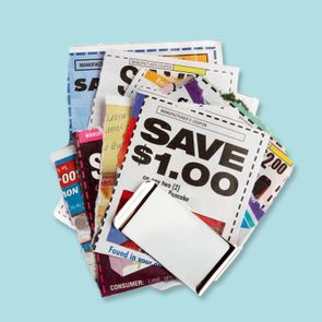 Coupons stacked on a light blue background, featuring various discounts like 