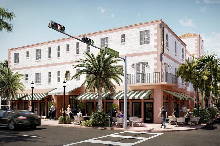 Building stands at street corner, people dine at outdoor tables under green-striped awnings, surrounded by palm trees. Sign reads 